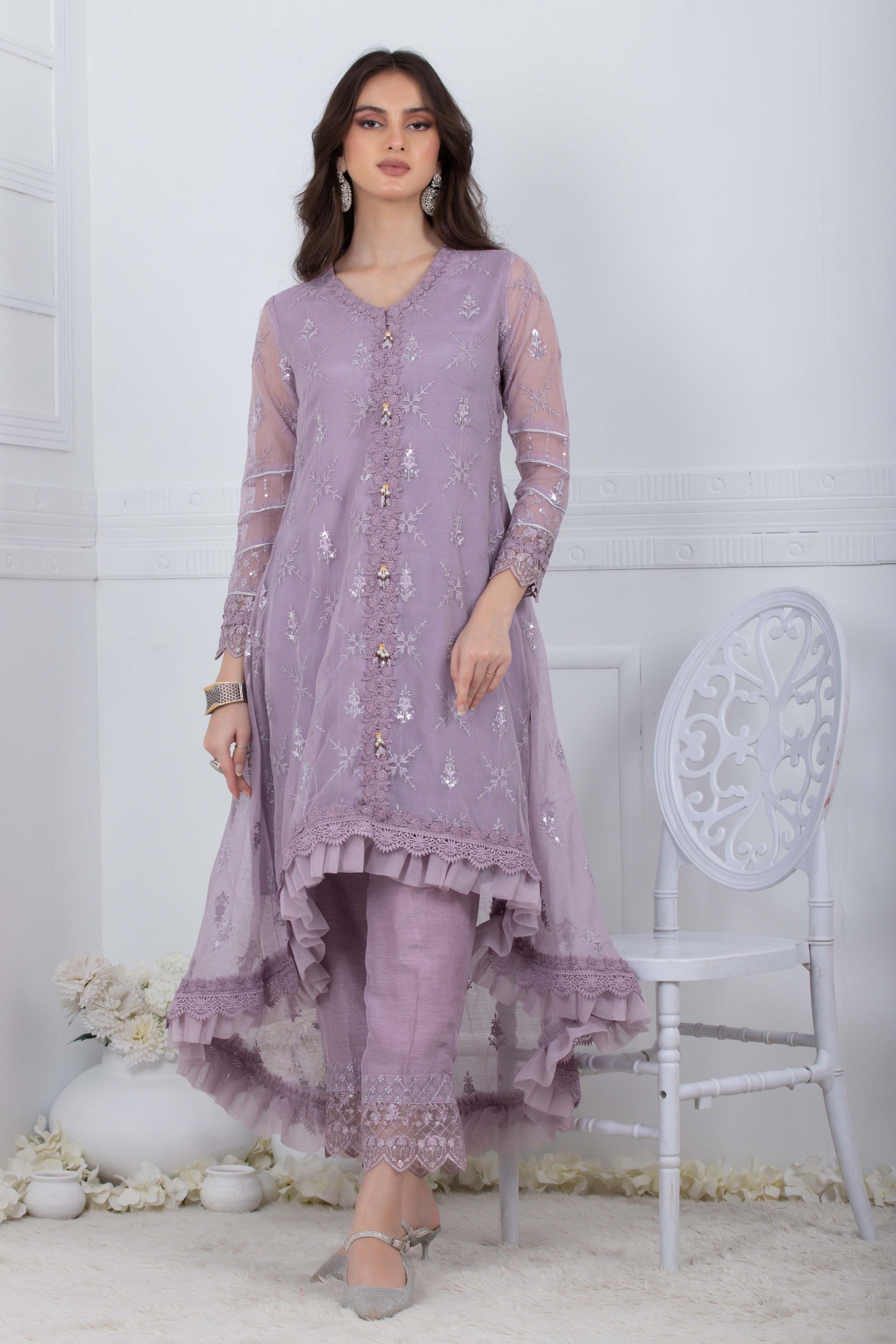 light purple pakistani dresses Lilac Luster Crafted on a serene shade of lilac, this magnificent chiffon attire with a fully embroidered and embellished shirt is elevated with the embroidered neckline, hem and sleeve pattis. Complemented